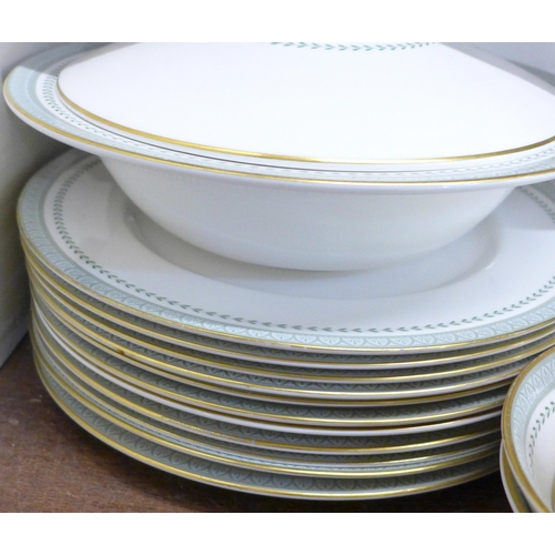 2042 - A Royal Doulton Berkshire tea and dinner service, 11 dinner plates, 7 tea plates, 7 saucers, 7 cups,... 