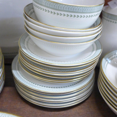 2042 - A Royal Doulton Berkshire tea and dinner service, 11 dinner plates, 7 tea plates, 7 saucers, 7 cups,... 