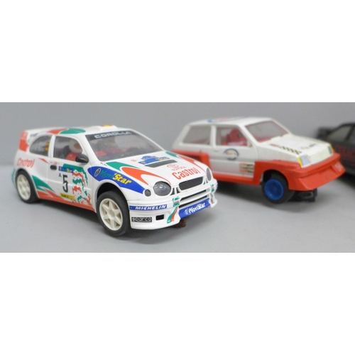 2053 - Five Scalextric model cars, four rally and Police Patrol