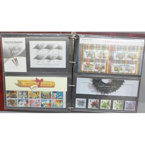 2083 - Stamps; an album of 40 Great Britain presentation packs with a face value of over £200