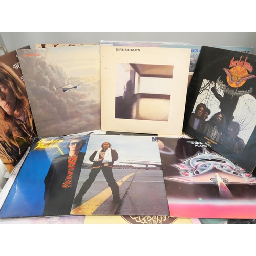 2100 - A collection of 20 Rock LP records including, Dire Straits, Meatloaf, Rick Wakeman, etc.