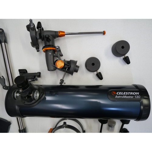 2109 - A Celestron Astromaster 130 telescope, includes 10mm and 20mm lenses, (fully working and complete)