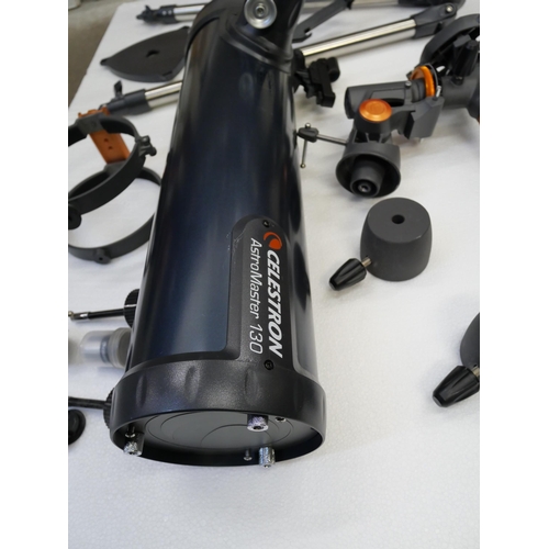 2109 - A Celestron Astromaster 130 telescope, includes 10mm and 20mm lenses, (fully working and complete)