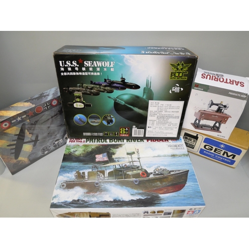 2113 - Four Revell model kits, a Tamiya model kit, a RC USS Seawolf, a Trumpeter model HMS Huron, three DVD... 