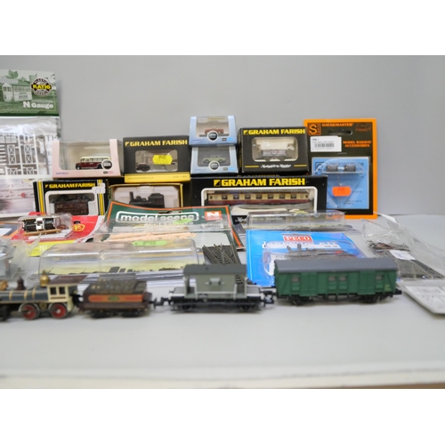 2115 - A box of N gauge model rail and accessories, some boxed, Minitrix locomotive, some Farish, Peco and ... 