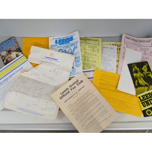 2138 - A collection of 1970s Leeds United fan club memorabilia including fifteen autographs on a single she... 