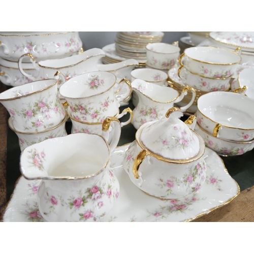 2159 - A large bone china Paragon dinner/tea service in the Victoriana Rose pattern with Royal Albert examp... 