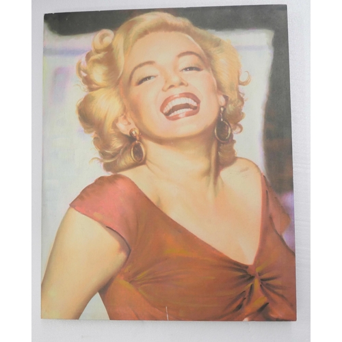 2160 - A collection of Marilyn Monroe pictures, framed and canvas examples. Together with a carry case **PL... 