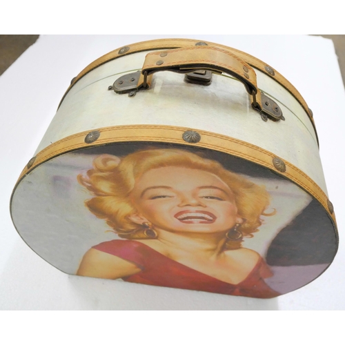 2160 - A collection of Marilyn Monroe pictures, framed and canvas examples. Together with a carry case **PL... 