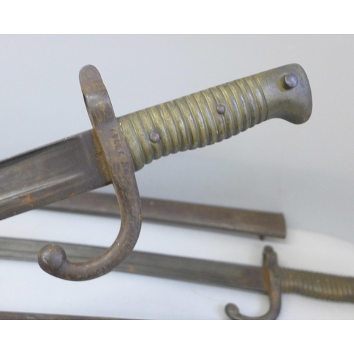 2177 - Two French 19th century bayonets with scabbards  **PLEASE NOTE THIS LOT IS NOT ELIGIBLE FOR IN-HOUSE... 