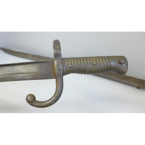 2177 - Two French 19th century bayonets with scabbards  **PLEASE NOTE THIS LOT IS NOT ELIGIBLE FOR IN-HOUSE... 