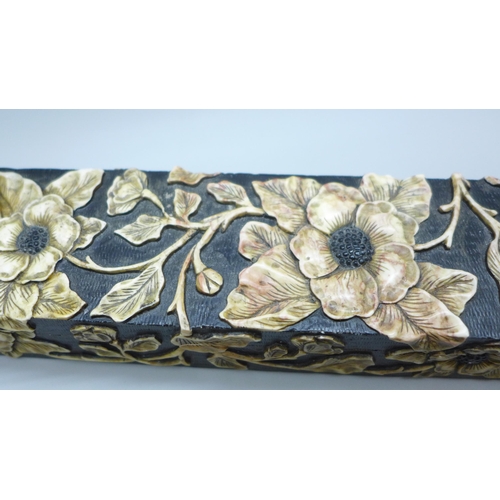 2192 - An oriental carved stone pen box with flower detail, 27.5cm