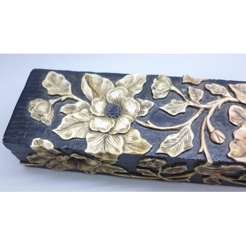 2192 - An oriental carved stone pen box with flower detail, 27.5cm