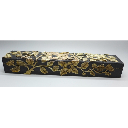 2192 - An oriental carved stone pen box with flower detail, 27.5cm