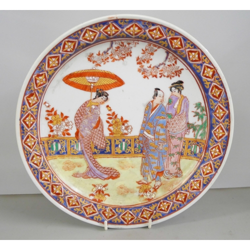 2219 - Two Japanese ceramic charger plates with central geisha scenes, and a Chinese dragon figure