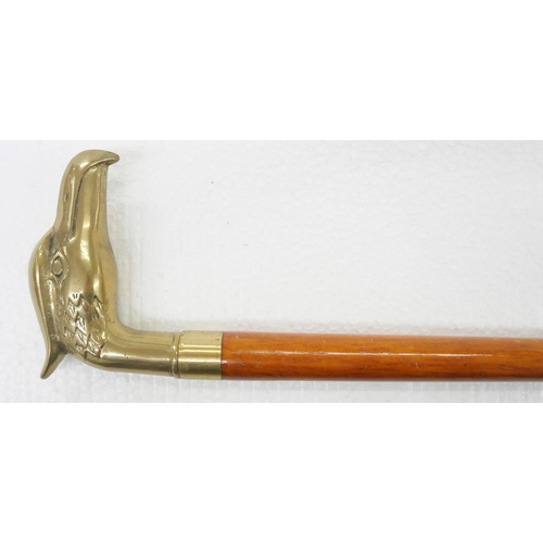 2244 - A wooden walking stick with brass eagle handle