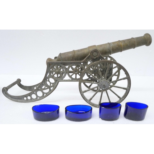 2249 - An assorted collection of items to include a large brass model cannon, small square brass stand, emp... 