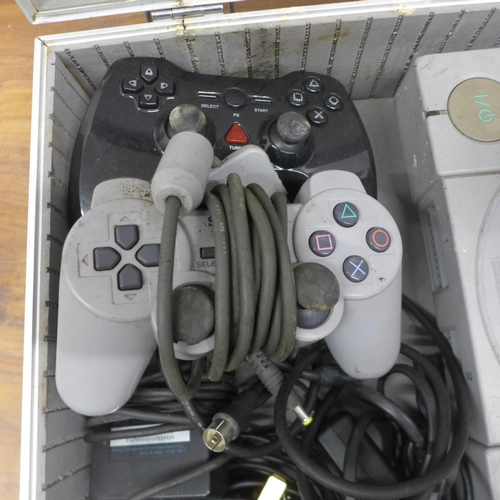 5075 - Two Sony PlayStation One games consoles with one official Sony PlayStation controller, one after mar... 