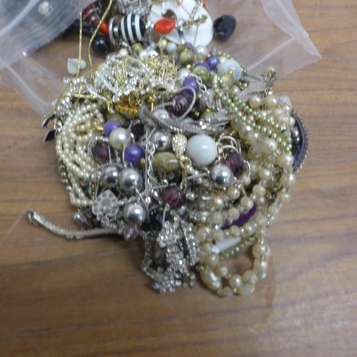 5089 - Two bags of assorted costume jewellery