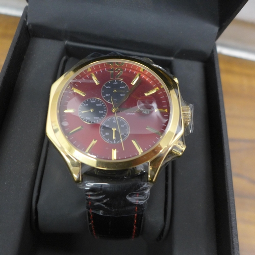 5094 - A boxed Gamages gent's automatic wristwatch, with hexagonal gold finished bezel and red face - hand ... 