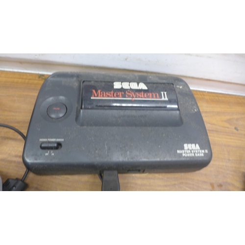 5095 - A quantity of retro gaming equipment including a Sega Master System II power base, a Nintendo 64 wir... 