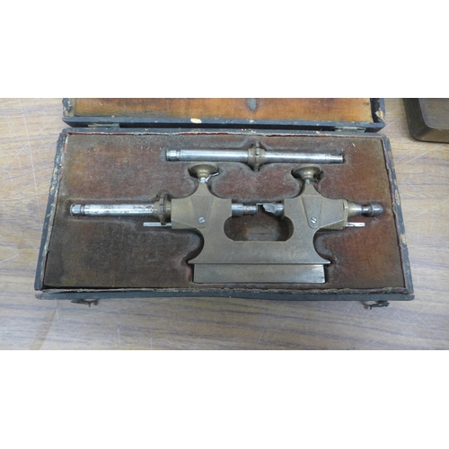 5106 - A watch makers clamp, a pair of engineers scales and a set square