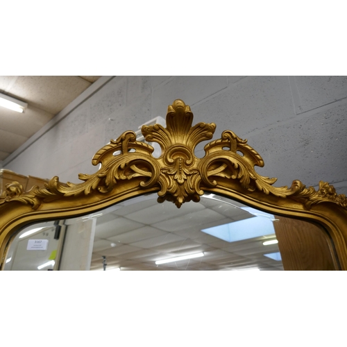 3116 - A large gilt effect carved framed mirror