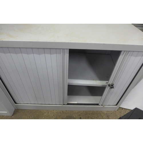 5186 - A Bisley four drawer filing cabinet and a Bisley sliding door stationery cabinet with keys