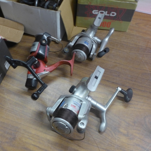 5298 - 9 assorted fishing reels including Matsuki, Avanti, etc., and a pair of caravan mirrors