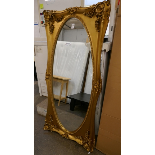 3123 - A large gilt effect carved framed mirror