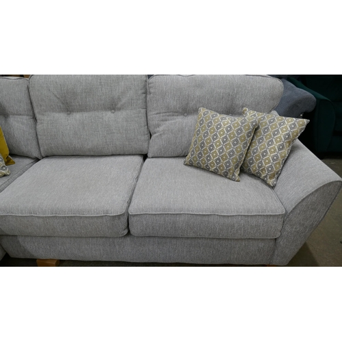 3181 - A grey fabric upholstered corner sofa and footstool