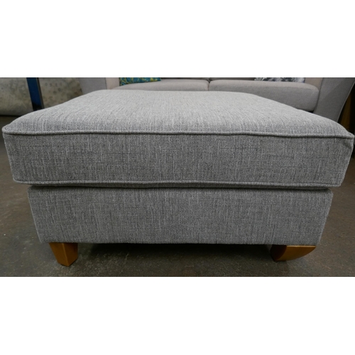 3181 - A grey fabric upholstered corner sofa and footstool