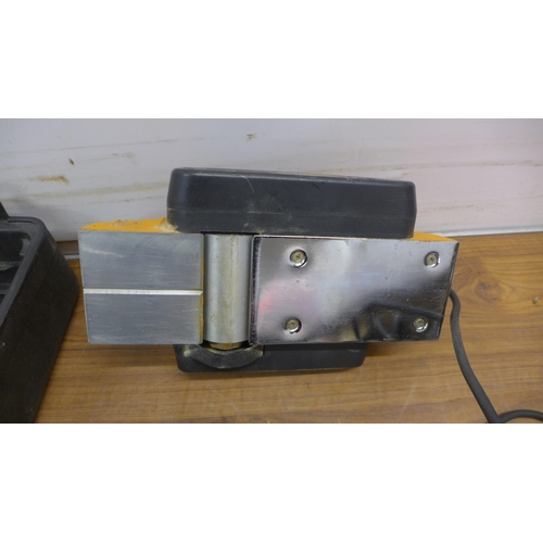 5042 - A cased JCB 240v handheld planer with 84mm width blade