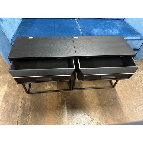 3139 - A pair of black single drawer bedsides