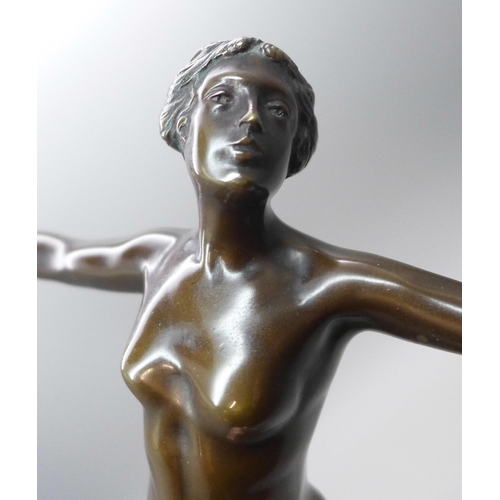 2001 - An Art Deco bronze figure of a female nude, on grey marble socle, 27.5cms h, one corner of the black... 