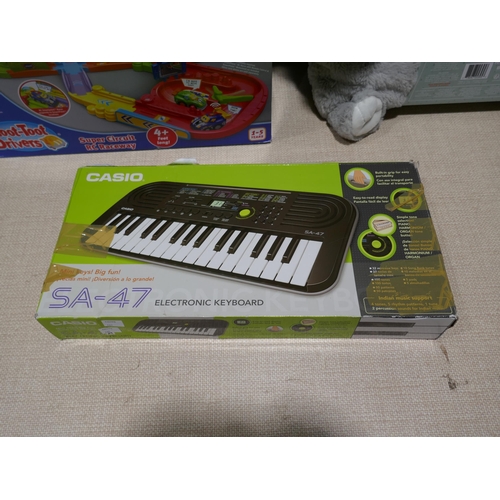 6191 - Casio Mini Keyboard, Toot Toot Drivers Raceway And Snuggle Me Too plush (349-265,278,283) *This lot ... 