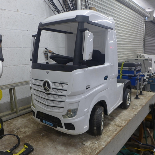 5195 - A battery powered Mercedes Benz Actros Child's ride along lorry cab - with charger