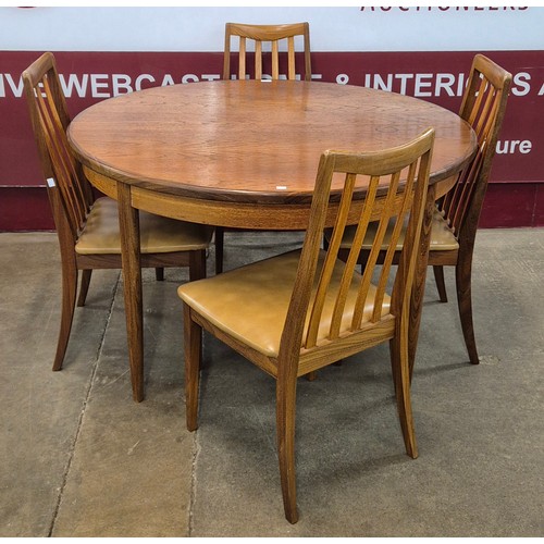 1 - A G-Plan Fresco teak circular extending dining table and four chairs