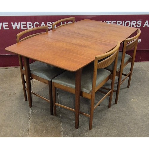 5 - A McIntosh teak extending T2 model dining table and four chairs