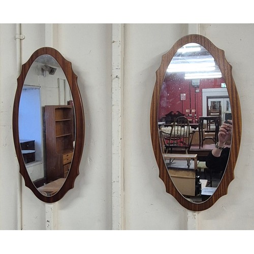 7 - A pair of oval teak framed mirrors