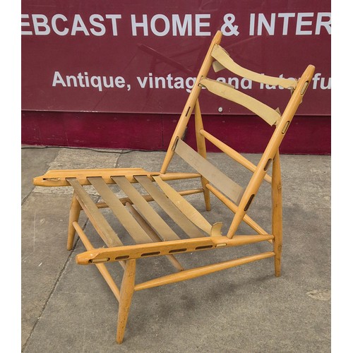 14 - An Ercol Blonde beech 427 model easy chair