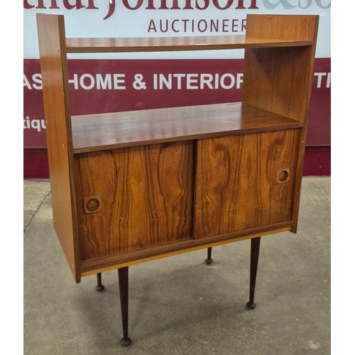 21 - A teak two door record cabinet