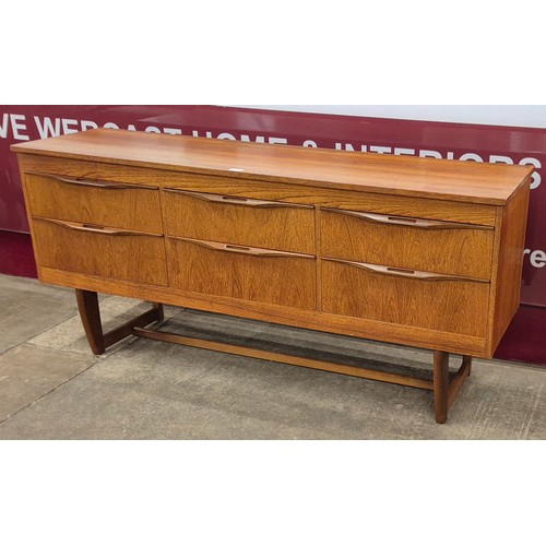 23 - A teak sideboard