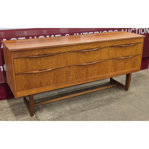 23 - A teak sideboard