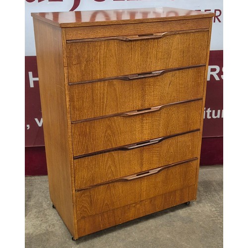 24 - A teak chest of drawers