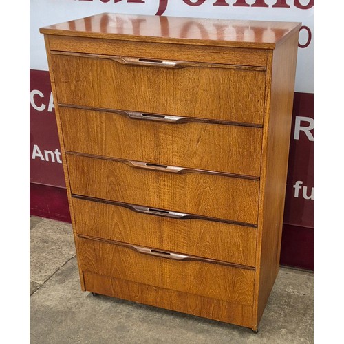 24 - A teak chest of drawers