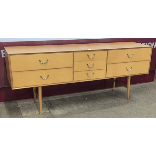 57 - An oak and birch veneered sideboard