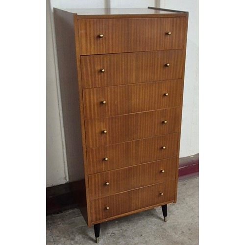 56 - A tola wood chest of drawers