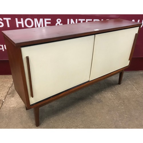 87 - A Swedish teak and white laminate two door cupboard