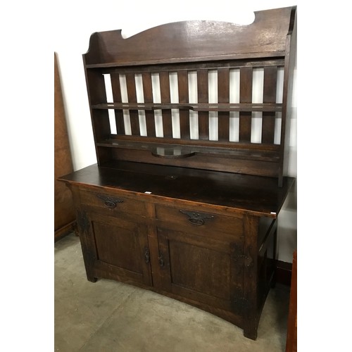 119 - An Arts & Crafts oak dresser